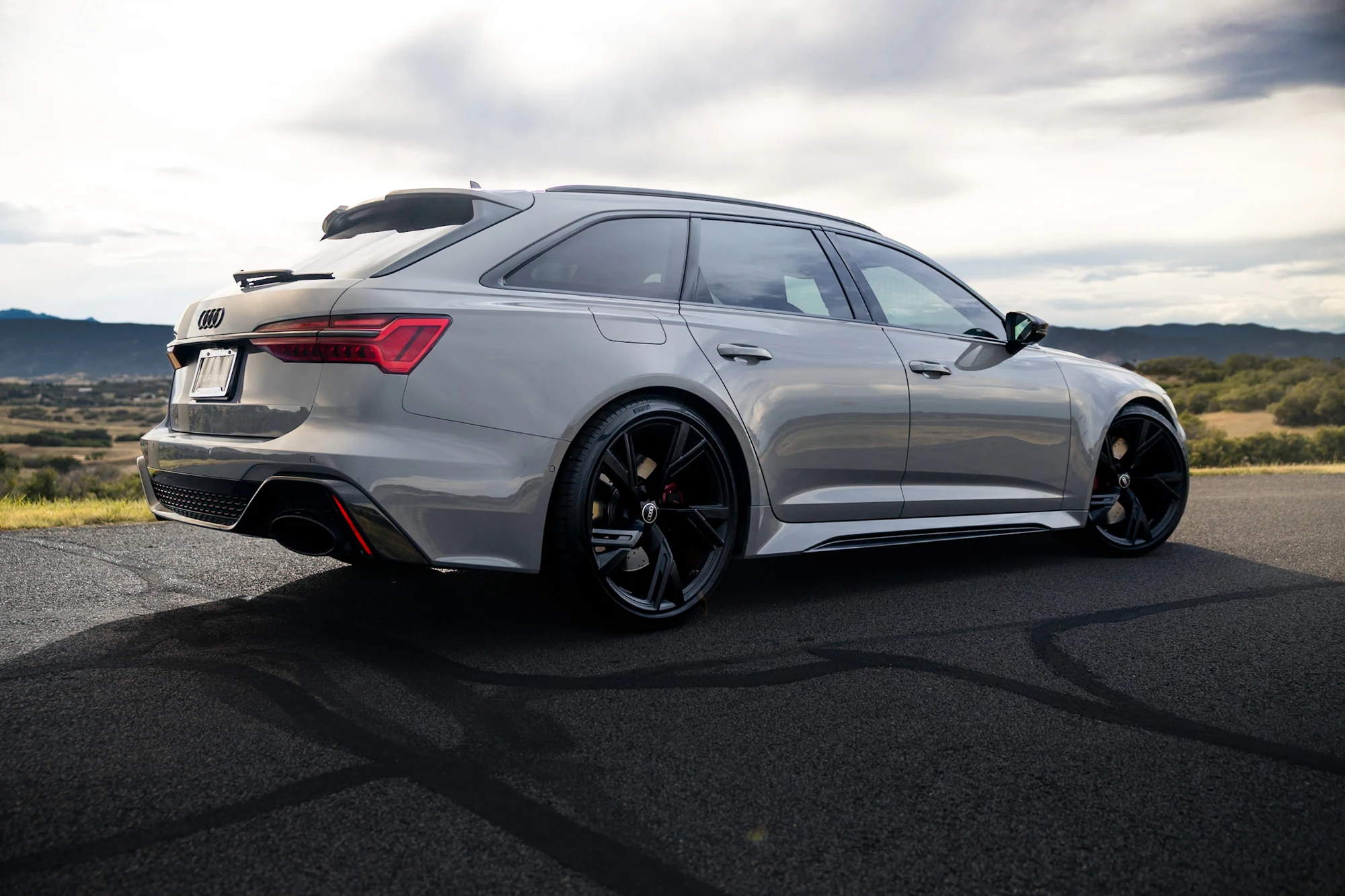 Audi RS 6 Avant in Nardo Gray parked on a Colorado overlook — selling a luxury or exotic car in Denver